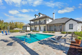 Waterfront Vacation Home with Heated Pool Dock and Beach Nearby